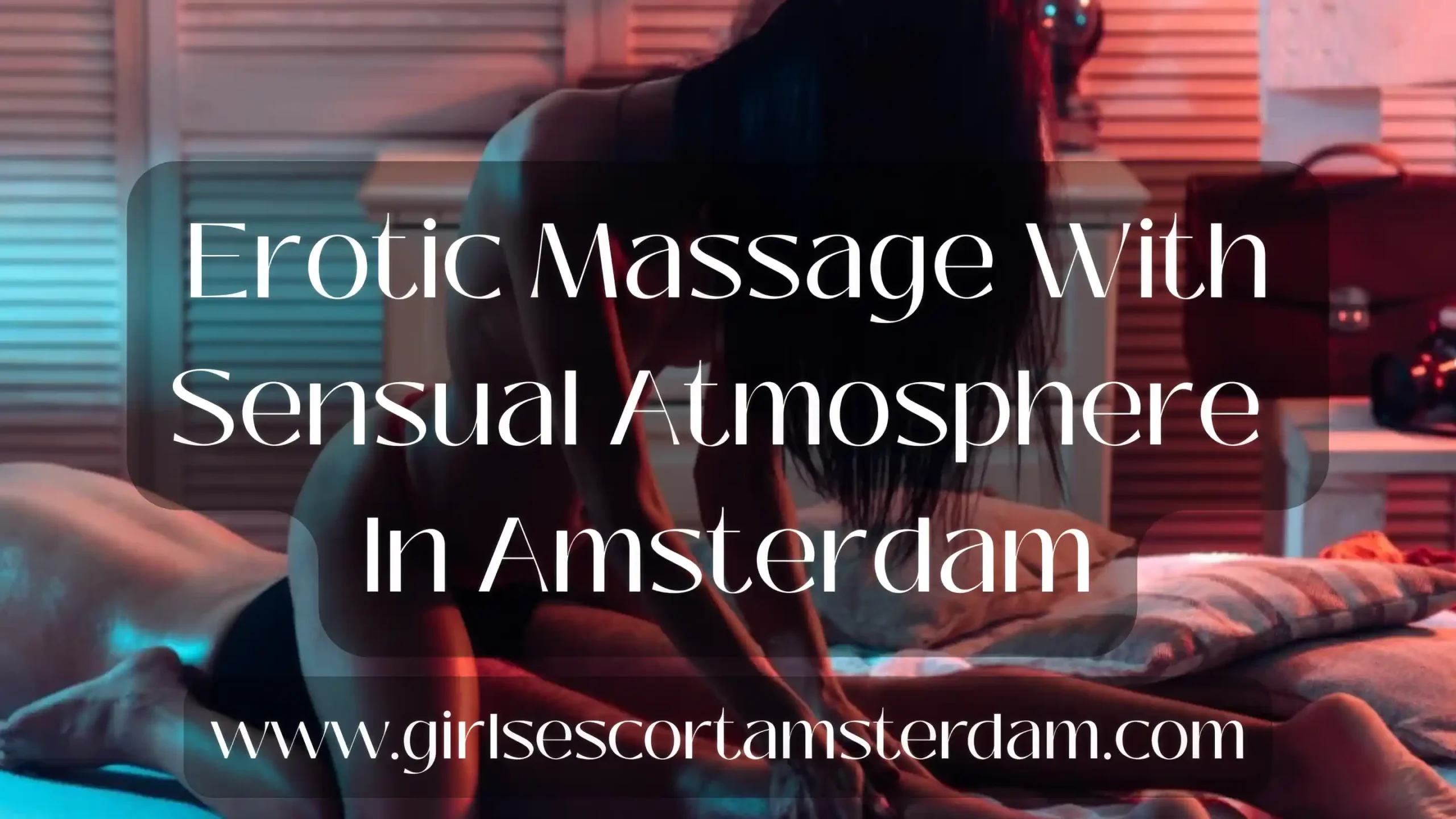 Erotic massage in Amsterdam with warm red lighting and sensual environment.